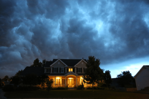 Well Lit House During Storm