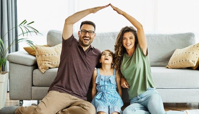 Family Making House Shape With Hands
