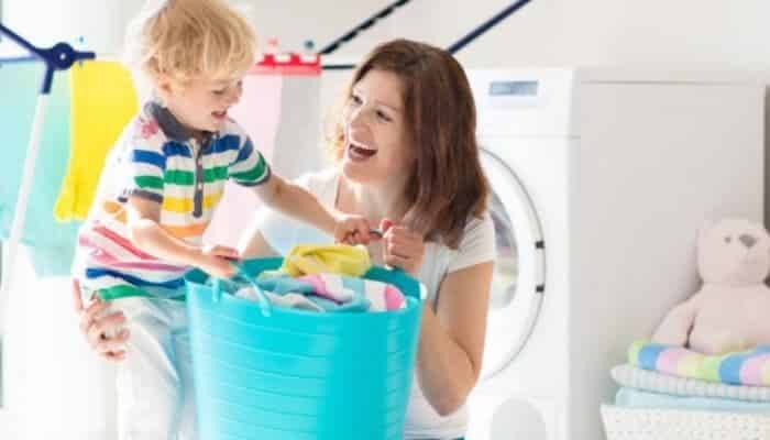 Mom With Child In Laundry Room
